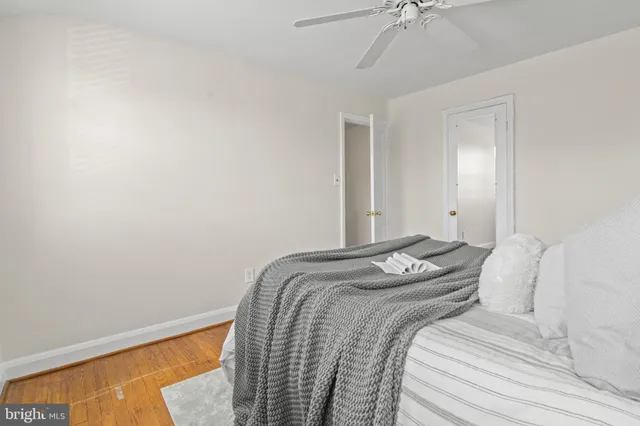 a bedroom with bed and a window