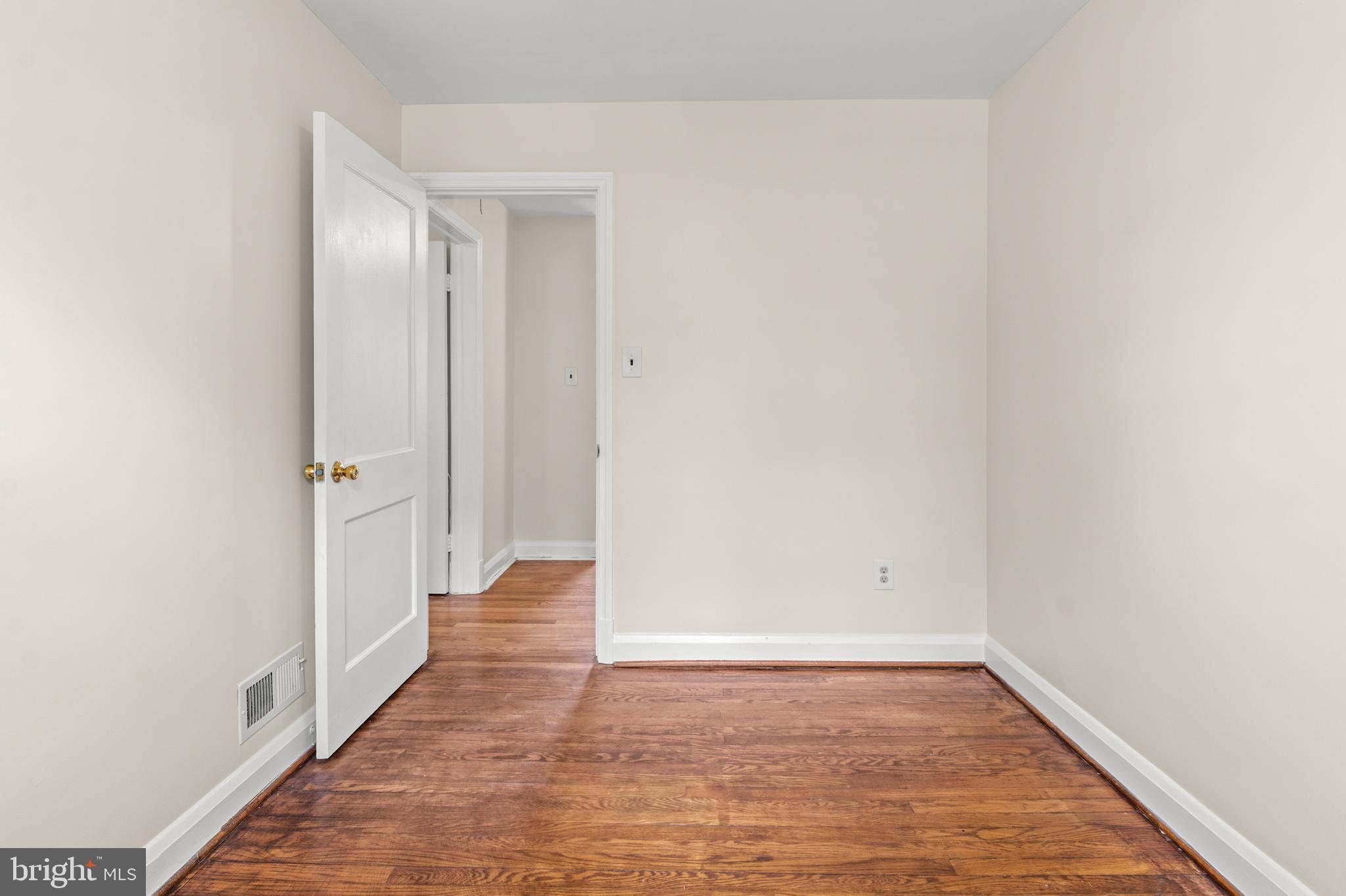1644 Thetford Road Towson, MD 21286 - Photo 26 of 40 a view of an empty room with wooden floor