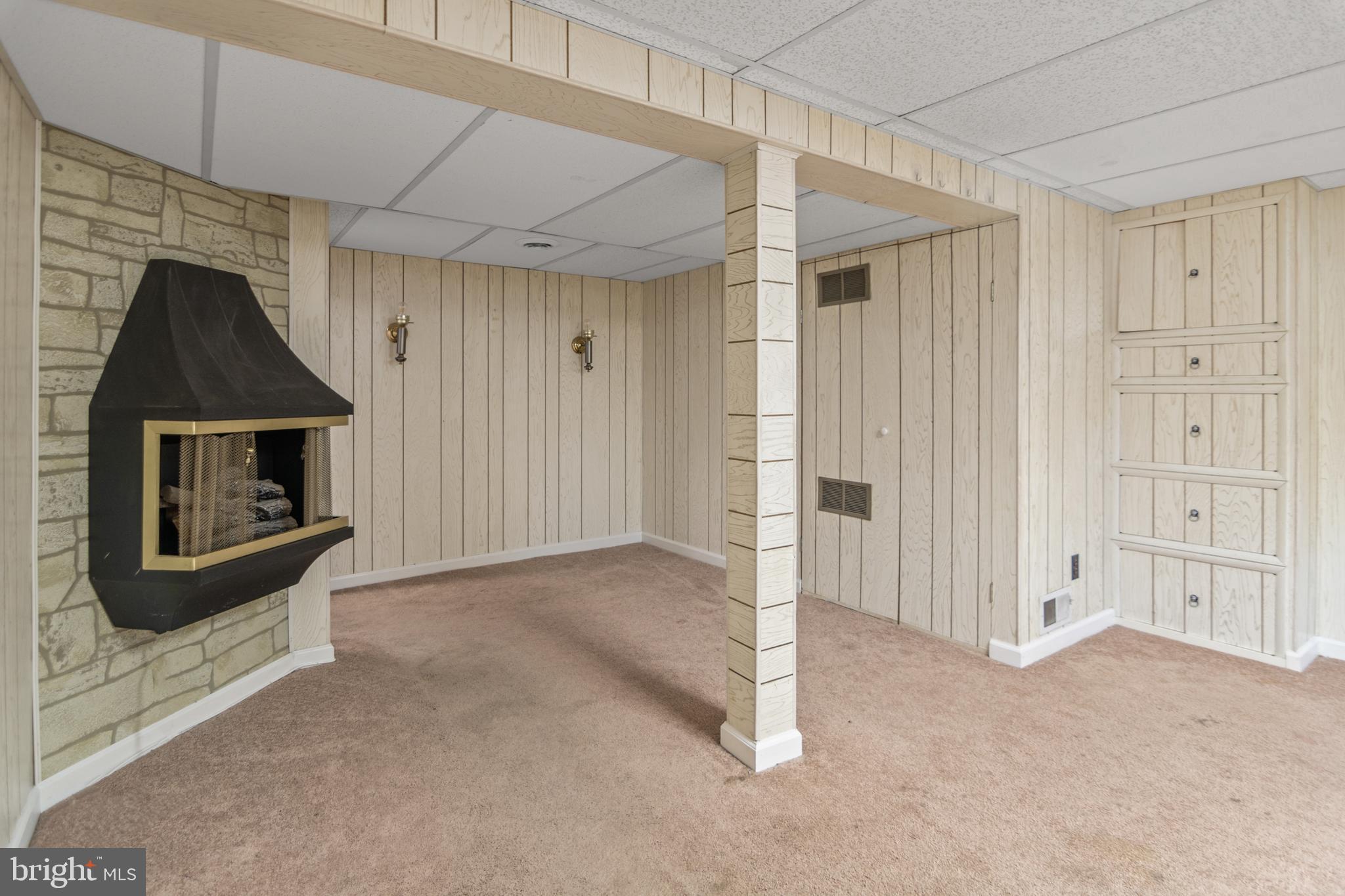 1644 Thetford Road Towson, MD 21286 - Photo 31 of 40 a view of empty room with fireplace and windows