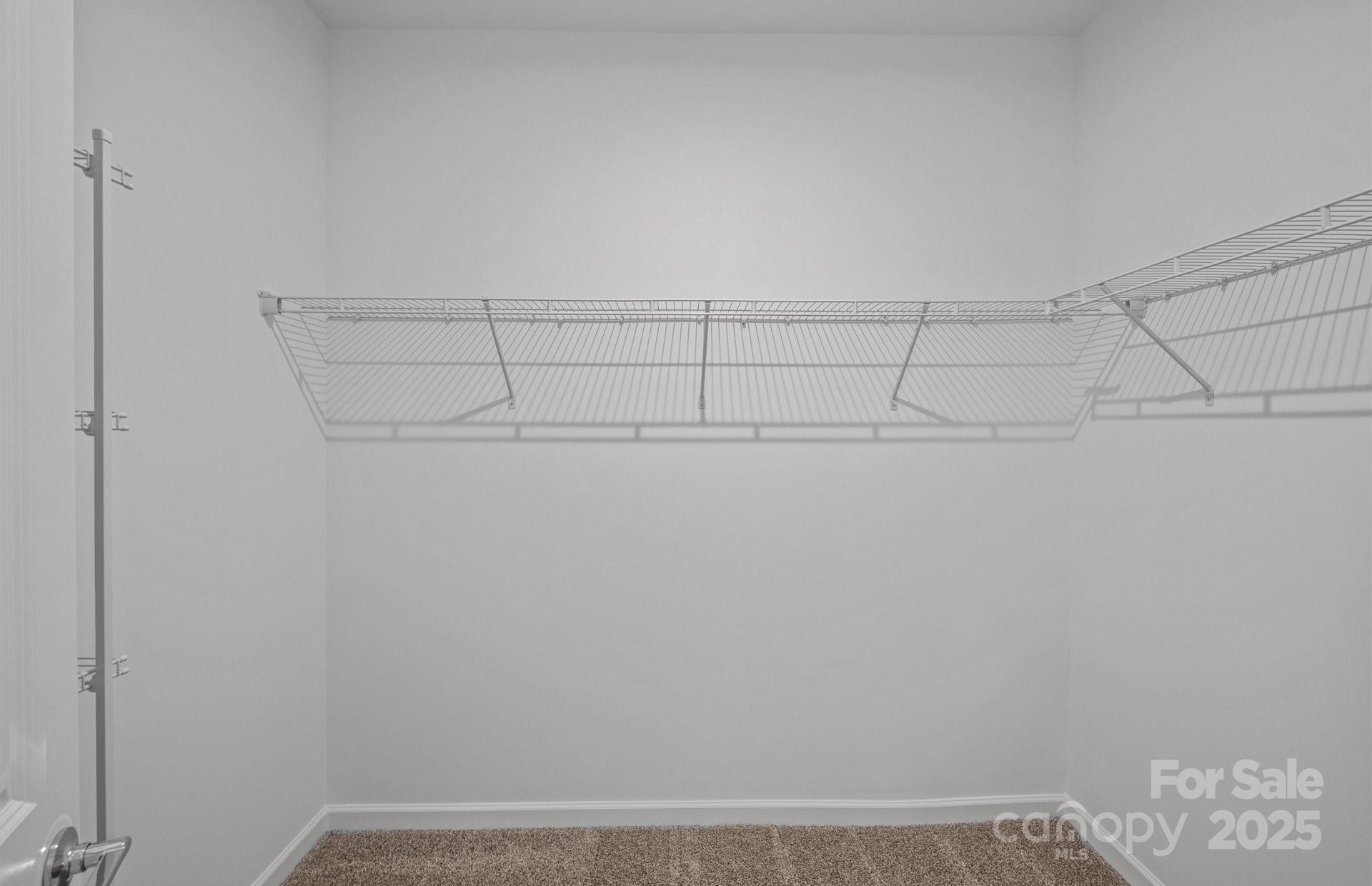 11416 Glasden Road, Unit 511 Charlotte, NC 28278 - Photo 9 of 13 a view of a room with racks on the wall