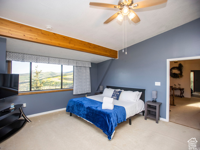 588 Raspberry Patch Road Garden City, UT 84028 - Photo 42 of 74 Carpeted bedroom with a ceiling fan and a mountain view