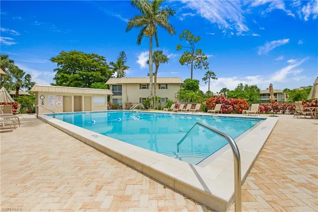 a view of swimming pool with a patio