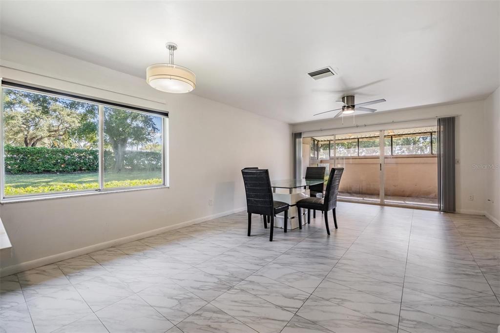 2292 Oak Neck Road, Unit A Clearwater, FL 33763 - Photo 12 of 37 a view of a dining room with furniture window and outside view