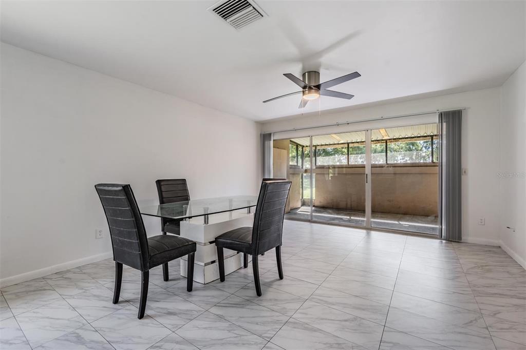 2292 Oak Neck Road, Unit A Clearwater, FL 33763 - Photo 15 of 37 a dining room with furniture and window