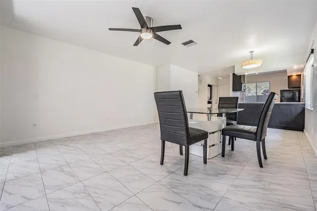 a view of a dining room with furniture