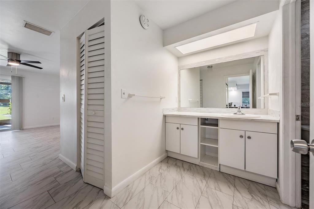 2292 Oak Neck Road, Unit A Clearwater, FL 33763 - Photo 22 of 37 a bathroom with a sink and a mirror