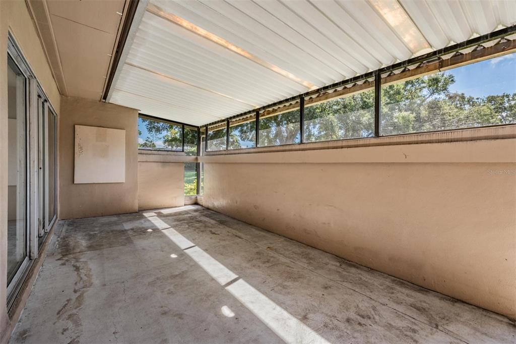 2292 Oak Neck Road, Unit A Clearwater, FL 33763 - Photo 26 of 37 a view of an empty room with windows