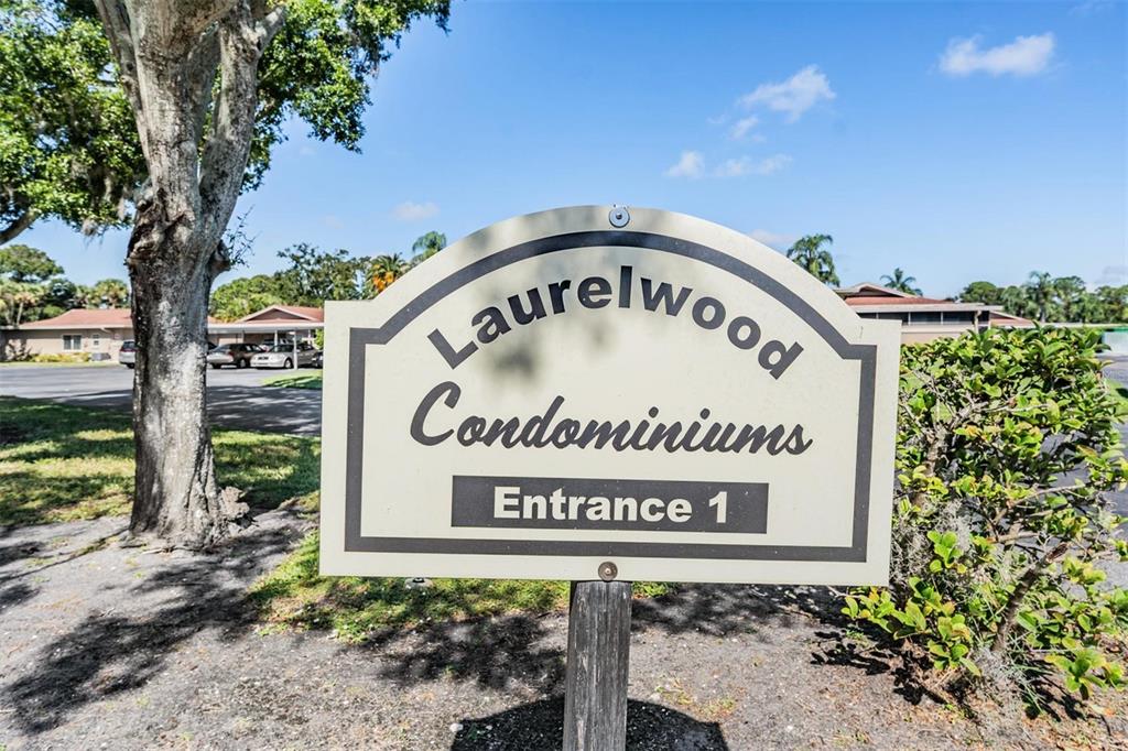 2292 Oak Neck Road, Unit A Clearwater, FL 33763 - Photo 29 of 37 a sign on the side of a building