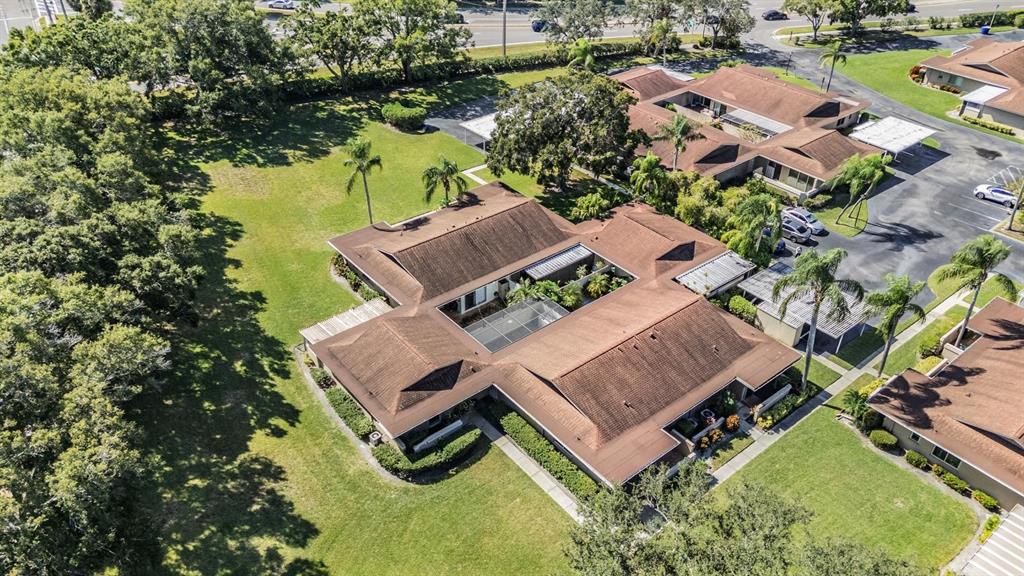 2292 Oak Neck Road, Unit A Clearwater, FL 33763 - Photo 33 of 37 an aerial view of residential house with outdoor space and trees all around