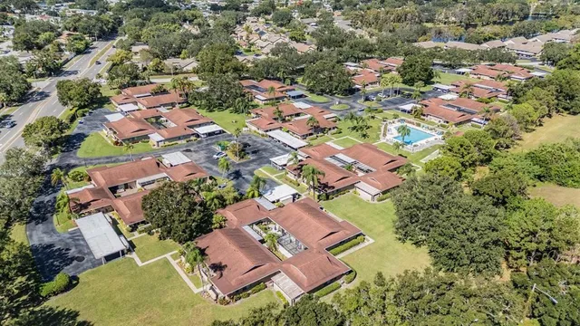 an aerial view of residential house with outdoor space and swimming pool