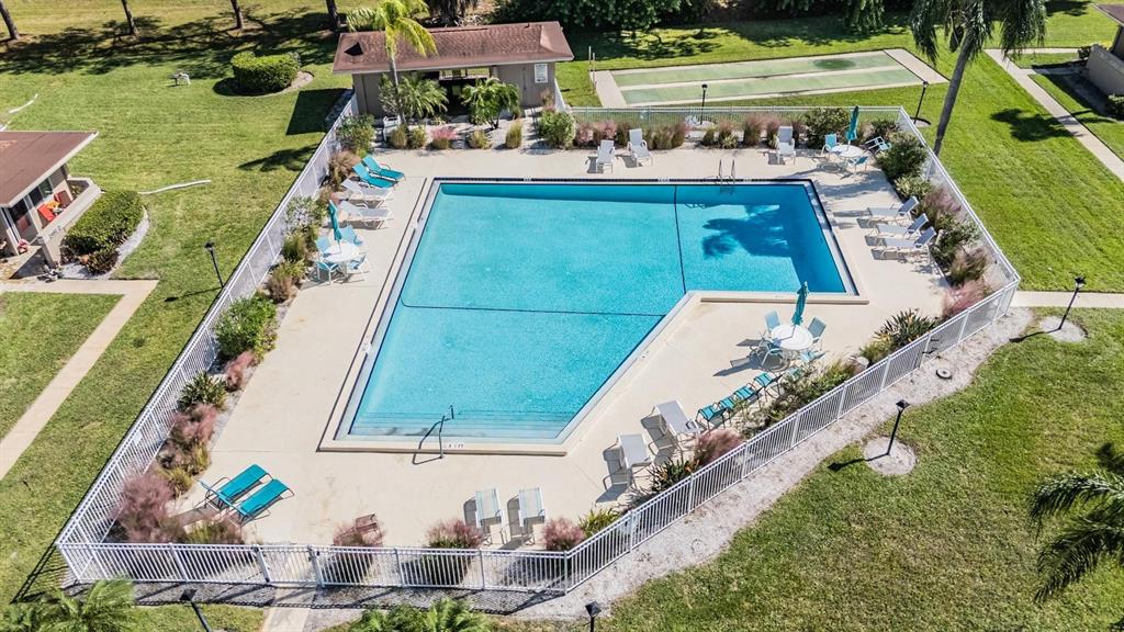 2292 Oak Neck Road, Unit A Clearwater, FL 33763 - Photo 36 of 37 a view of swimming pool with a patio and garden