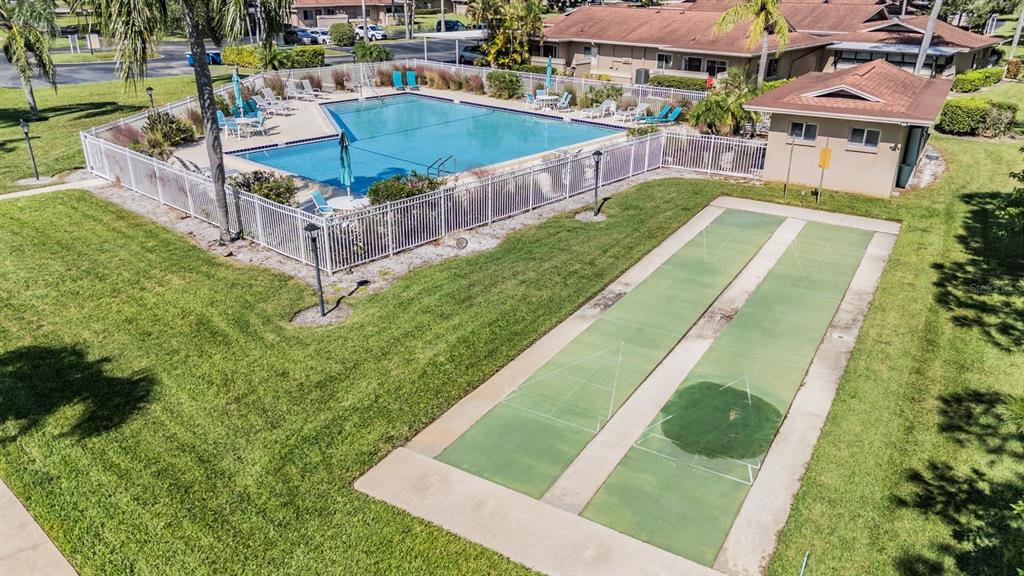 2292 Oak Neck Road, Unit A Clearwater, FL 33763 - Photo 37 of 37 a view of a swimming pool with a patio and a yard
