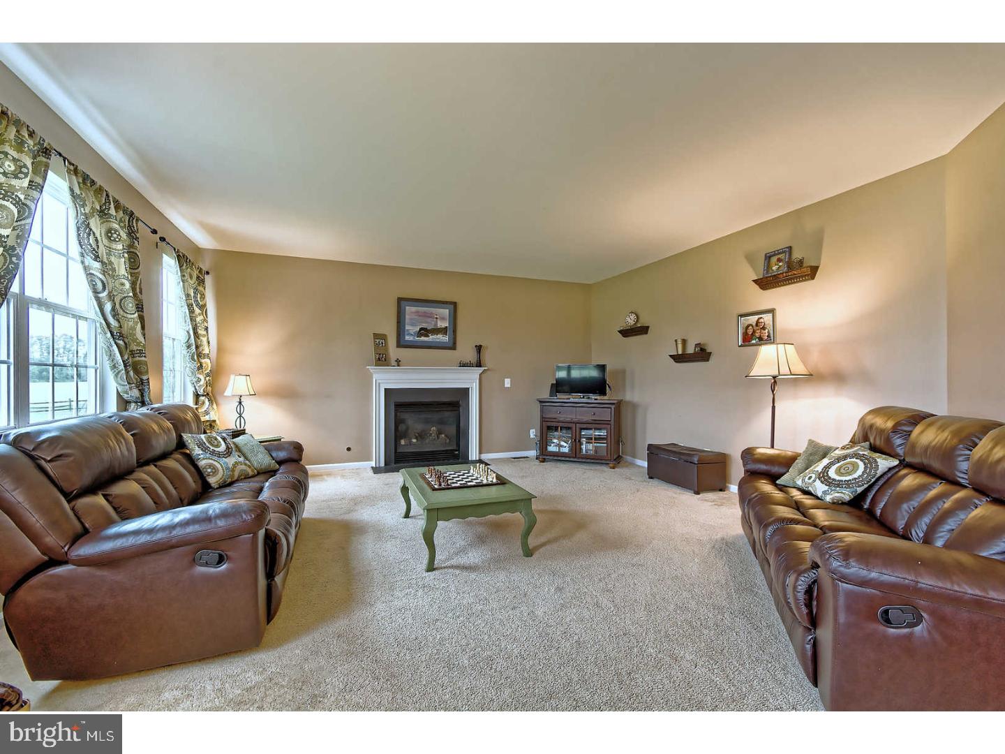 715 Farmhouse Road Mickleton, NJ 08056 - Photo 8 of 24 a living room with furniture fireplace and a large window