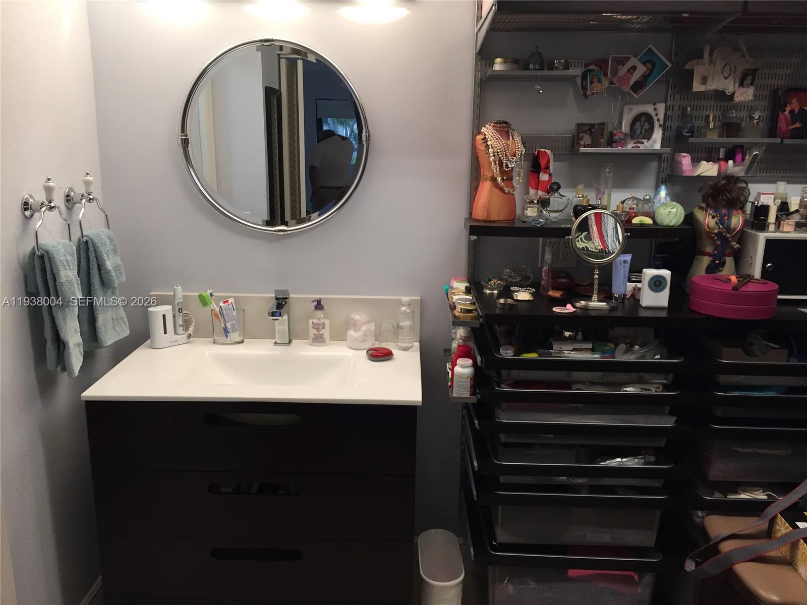 13253 Southwest 111th Terrace, Unit 3 Miami, FL 33186 - Photo 20 of 48 a bathroom with a sink and a mirror