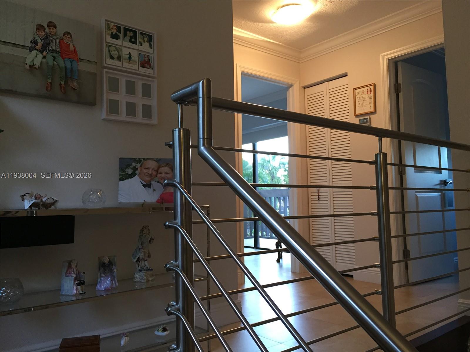 13253 Southwest 111th Terrace, Unit 3 Miami, FL 33186 - Photo 21 of 48 a storage room with wooden floor and cabinets