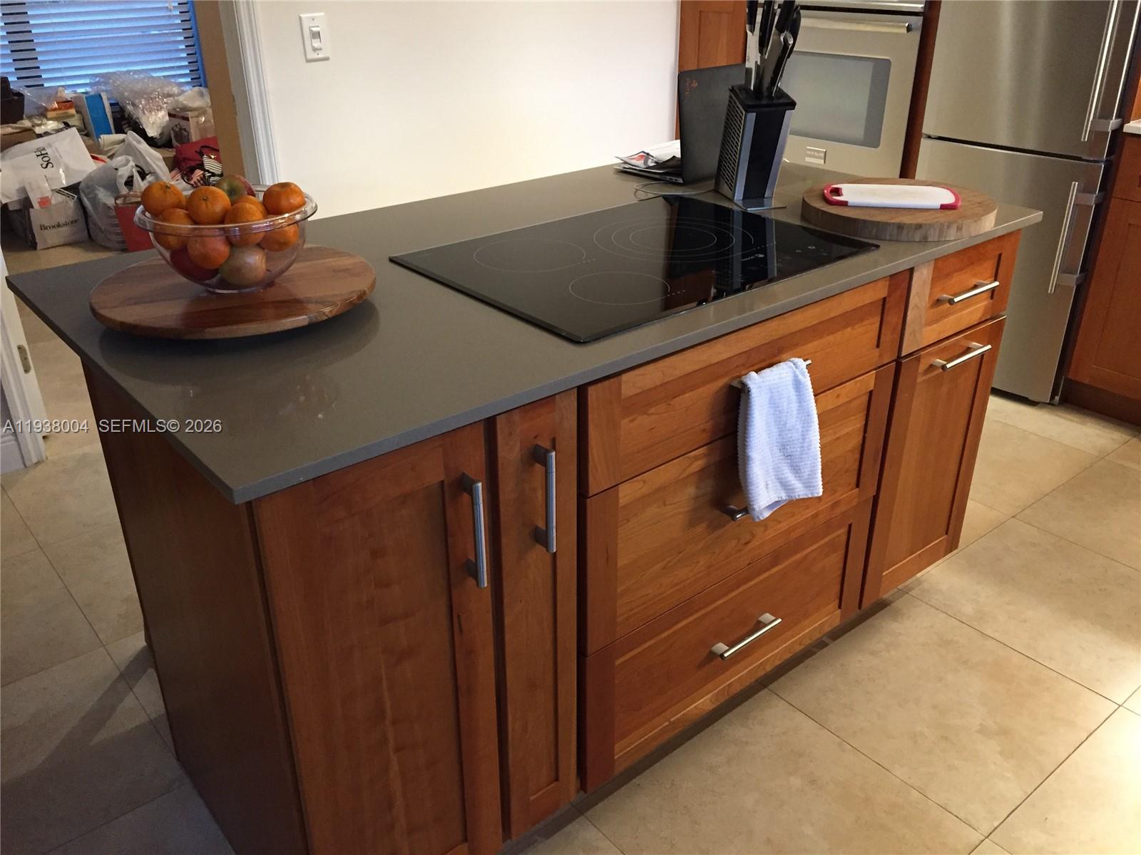 13253 Southwest 111th Terrace, Unit 3 Miami, FL 33186 - Photo 26 of 48 a kitchen with stainless steel appliances granite countertop a sink and a stove
