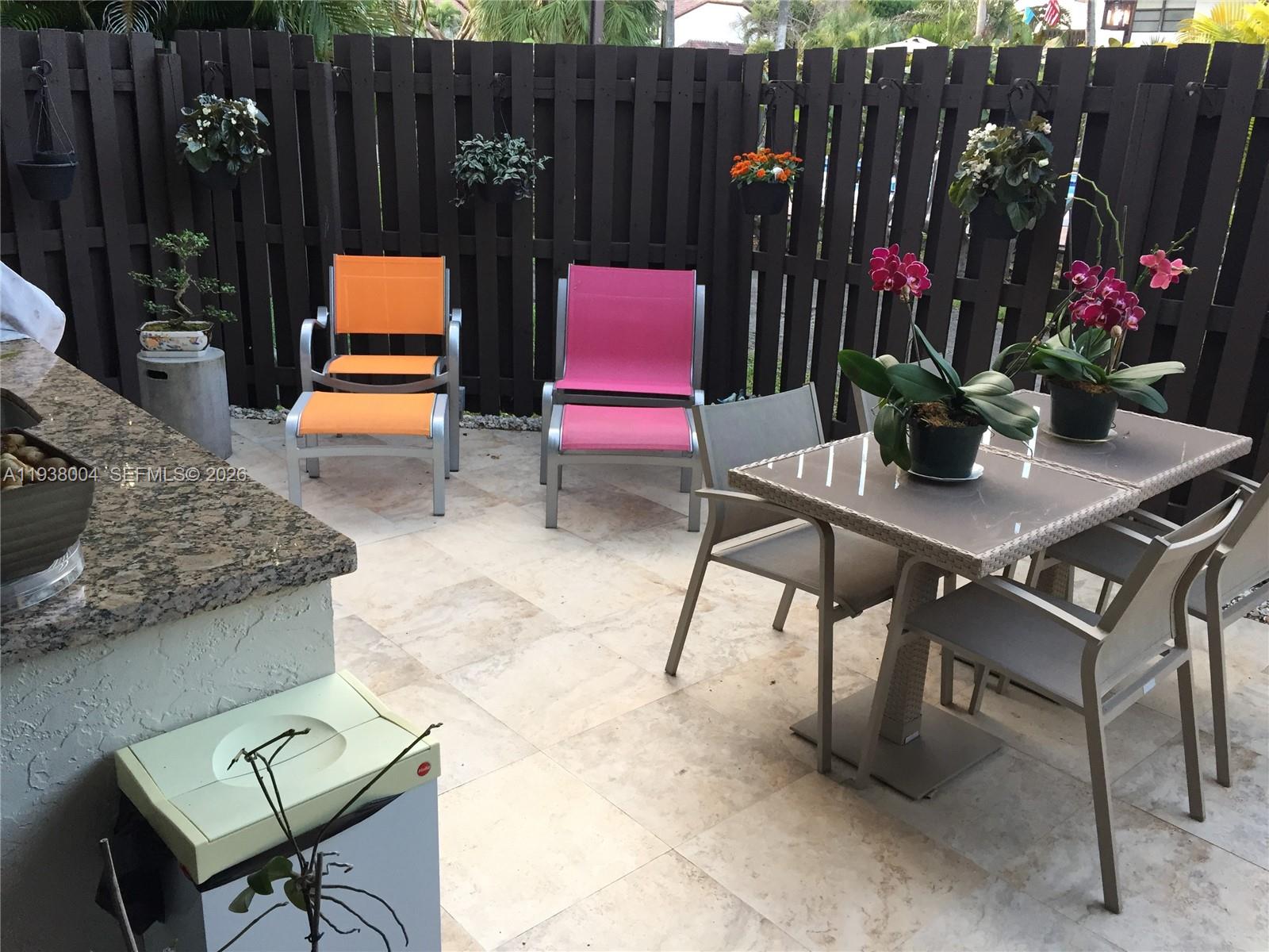 13253 Southwest 111th Terrace, Unit 3 Miami, FL 33186 - Photo 30 of 48 a outdoor space with chairs and television