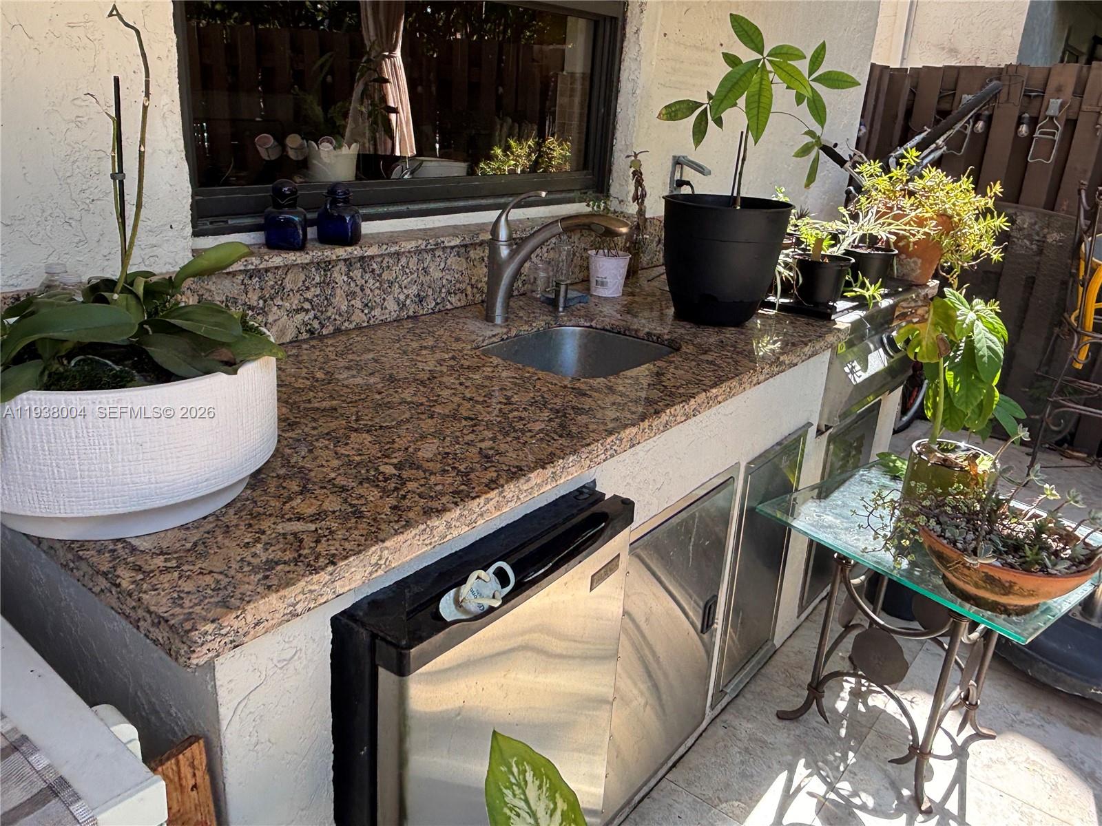 13253 Southwest 111th Terrace, Unit 3 Miami, FL 33186 - Photo 42 of 48 a view of outdoor space with seating area