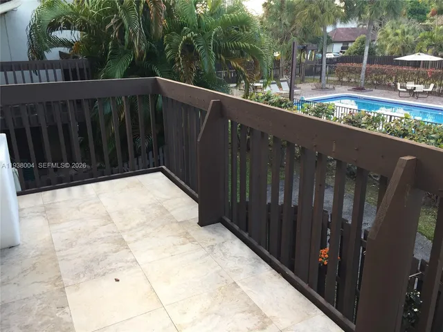 a view of balcony with yard