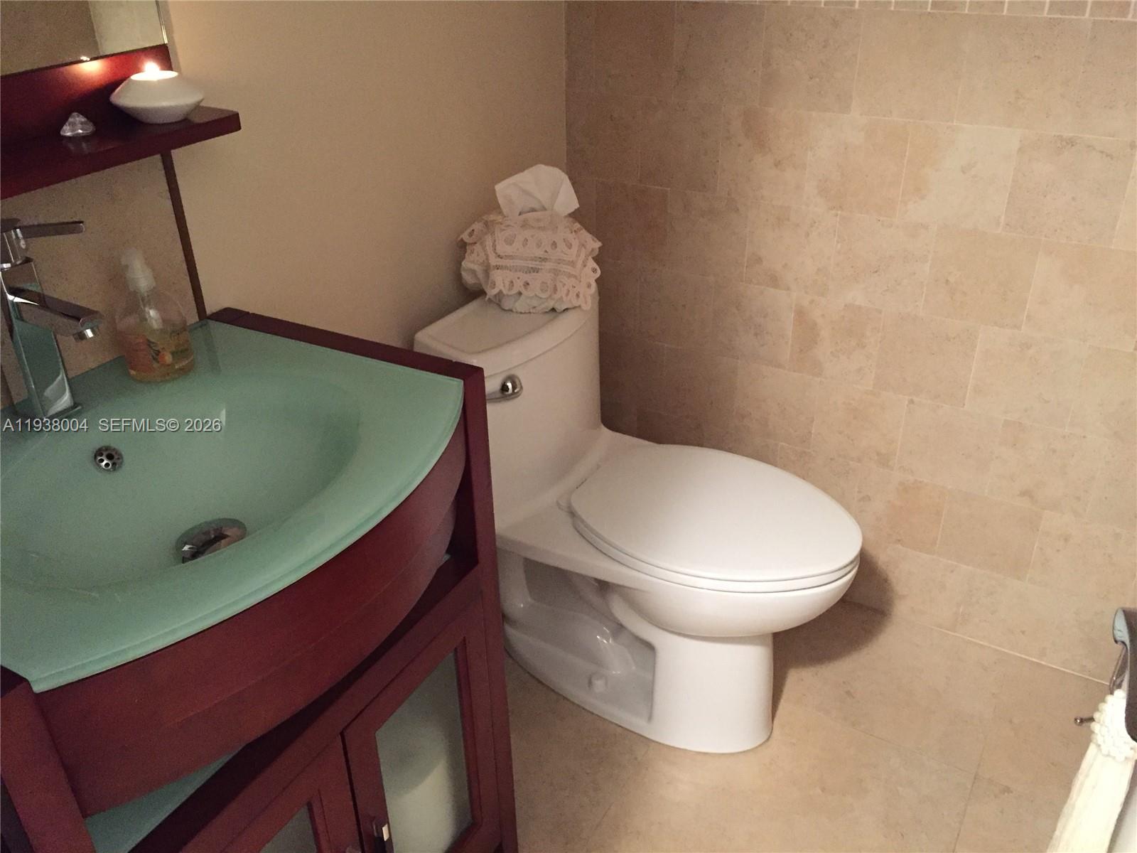 13253 Southwest 111th Terrace, Unit 3 Miami, FL 33186 - Photo 10 of 48 a bathroom with a sink and a toilet