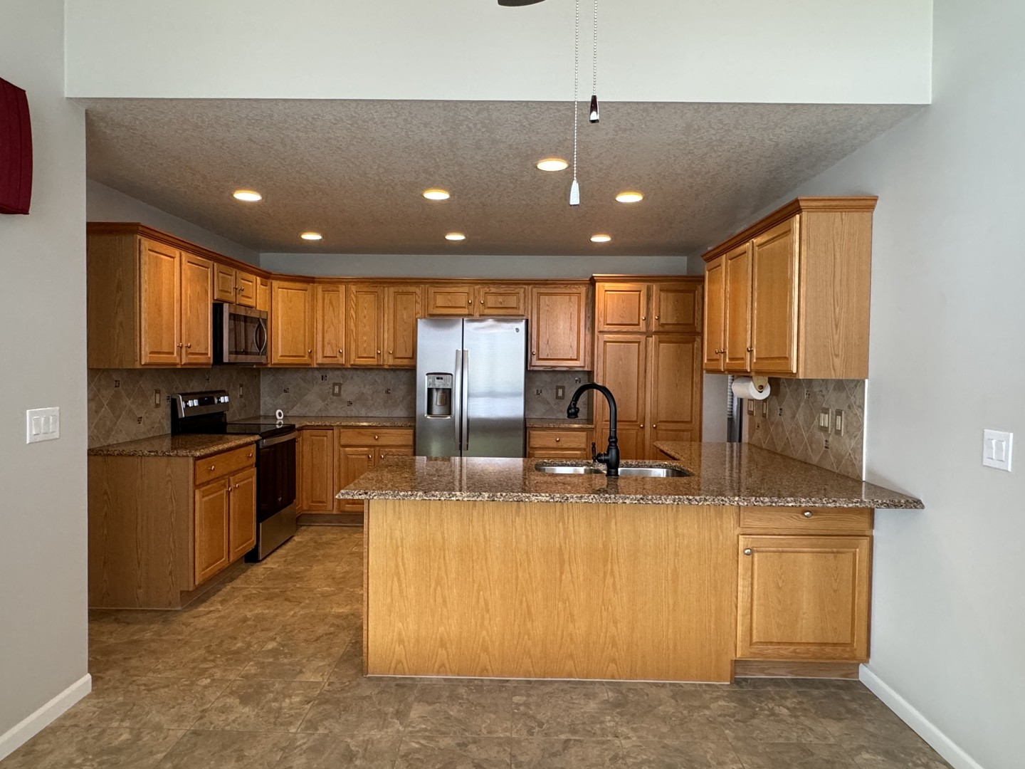 453 East Kay Street Herscher, IL 60941 - Photo 13 of 54 a large kitchen with stainless steel appliances granite countertop a large counter top