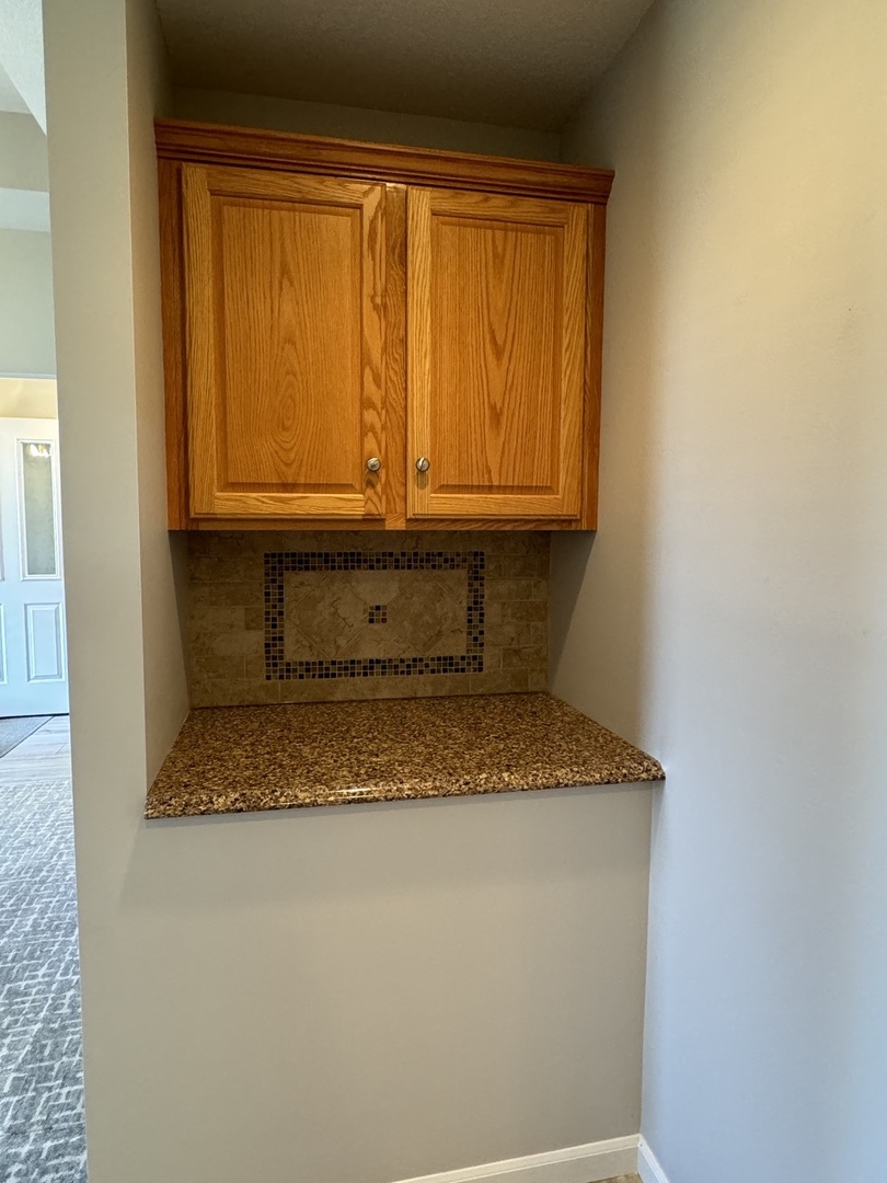 453 East Kay Street Herscher, IL 60941 - Photo 18 of 54 a bathroom with a granite countertop sink and a mirror
