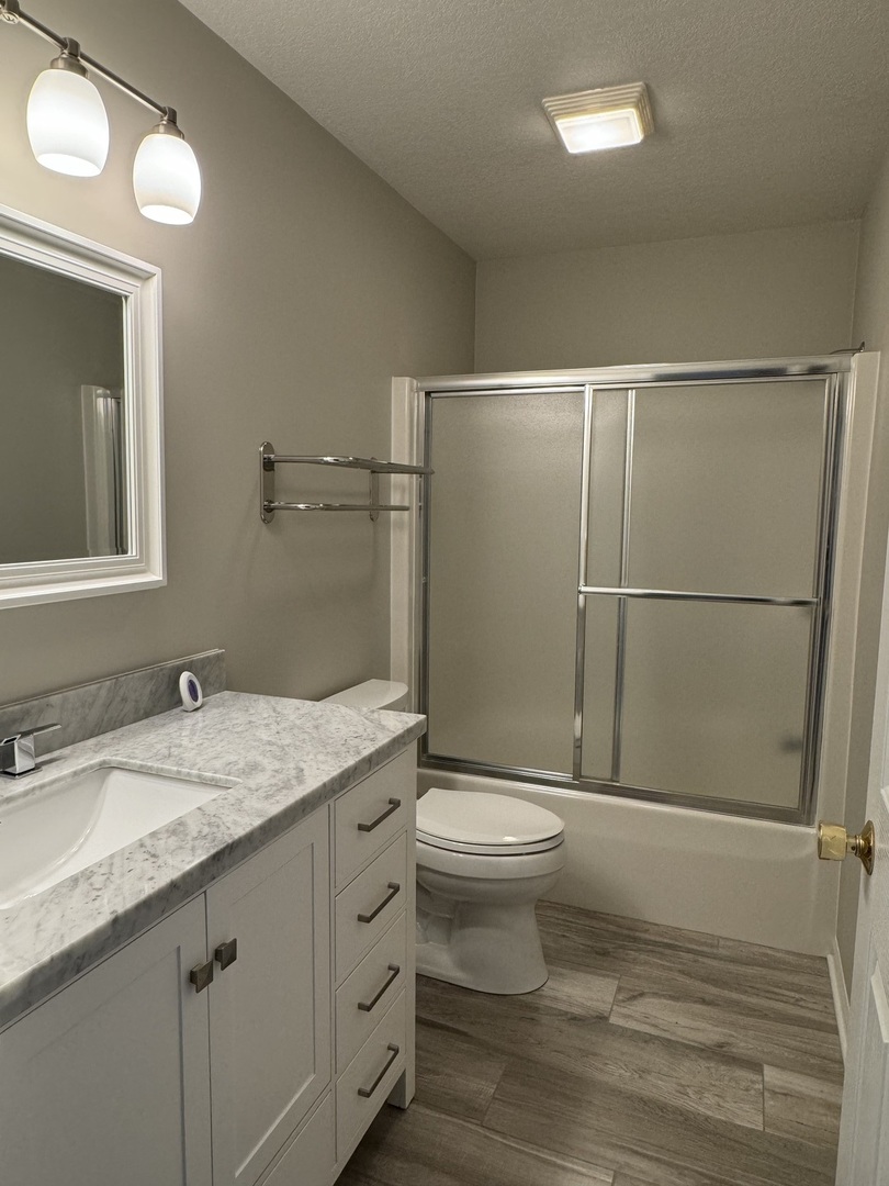 453 East Kay Street Herscher, IL 60941 - Photo 33 of 54 a bathroom with a granite countertop sink toilet and shower