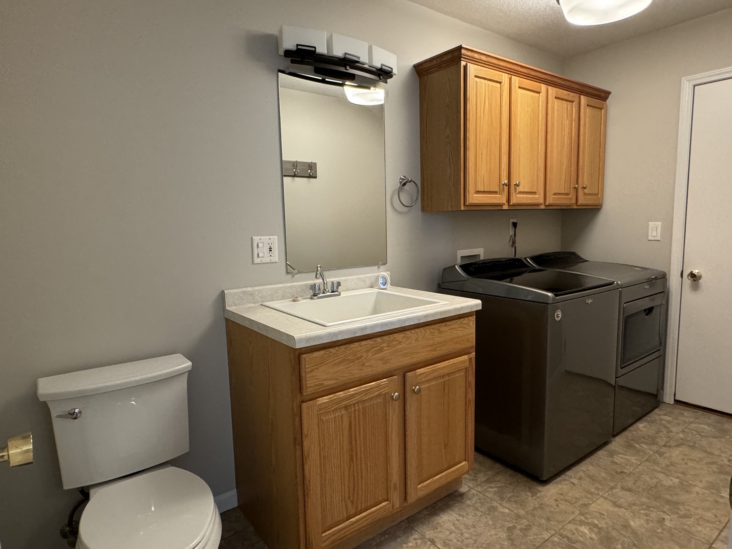 453 East Kay Street Herscher, IL 60941 - Photo 34 of 54 a utility room with a sink a toilet and a mirror