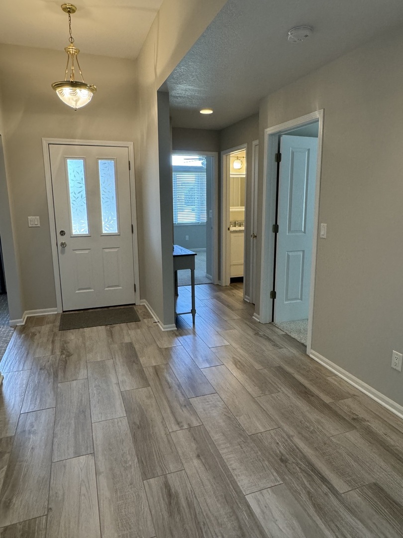 453 East Kay Street Herscher, IL 60941 - Photo 6 of 54 wooden floor in an empty room with a window