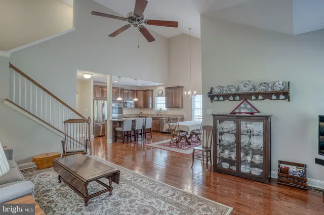 a living room with furniture fireplace and window