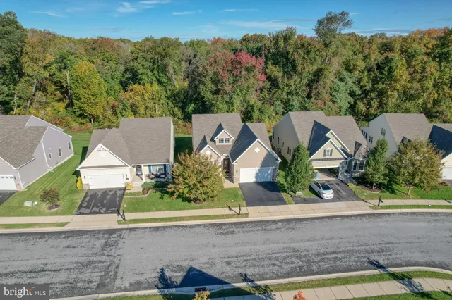 an aerial view of a house with a garden