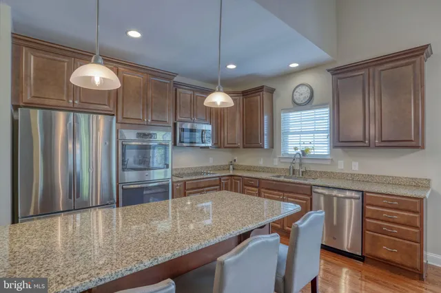 a kitchen with a table and chairs in it