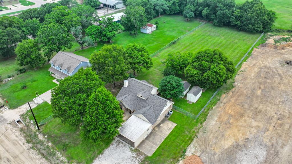 Beautiful 1 acre property in full Spring Bloom located in Needville, TX!  Claim your piece of the country today!  Roof--July 2023.  Workshop & Storage Shed in the back.