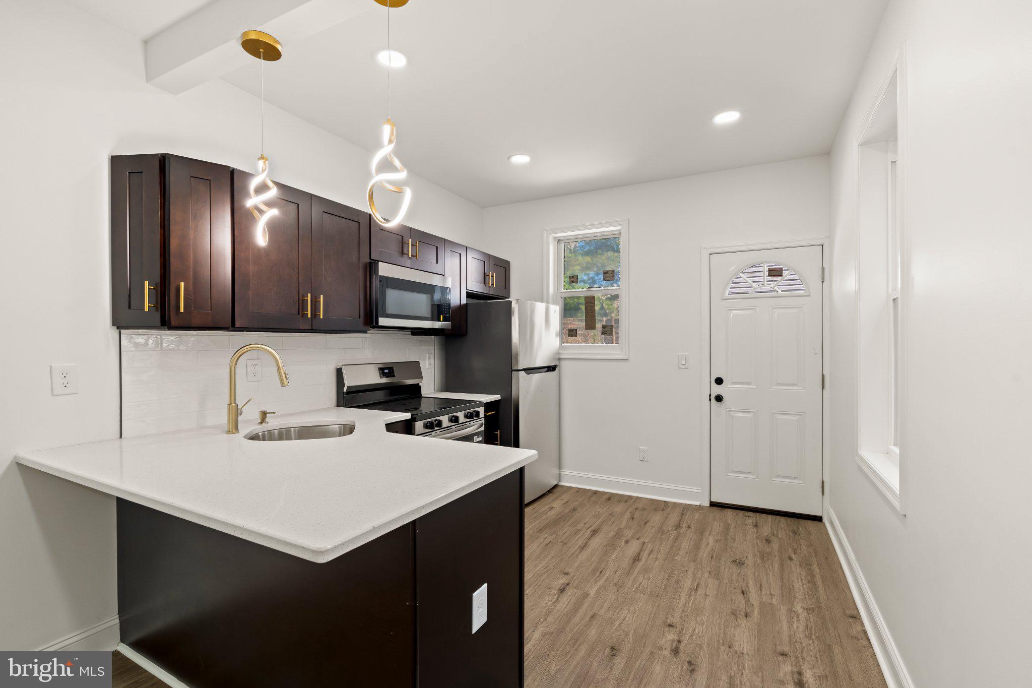 2933 Master Street Philadelphia, PA 19121 - Photo 6 of 20 Modern kitchen with sleek finishes.