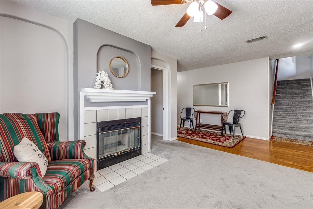 1017 Lake Trail Drive Little Elm, TX 75068 - Photo 11 of 35 a living room with furniture and a fireplace