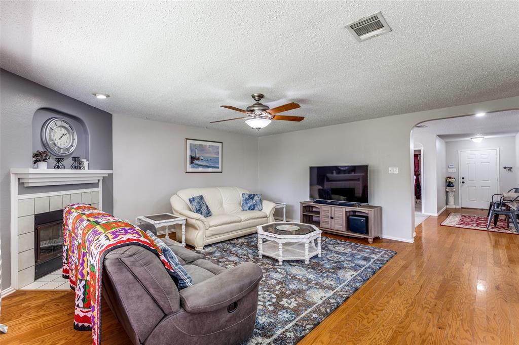 1017 Lake Trail Drive Little Elm, TX 75068 - Photo 14 of 35 a living room with furniture and a flat screen tv