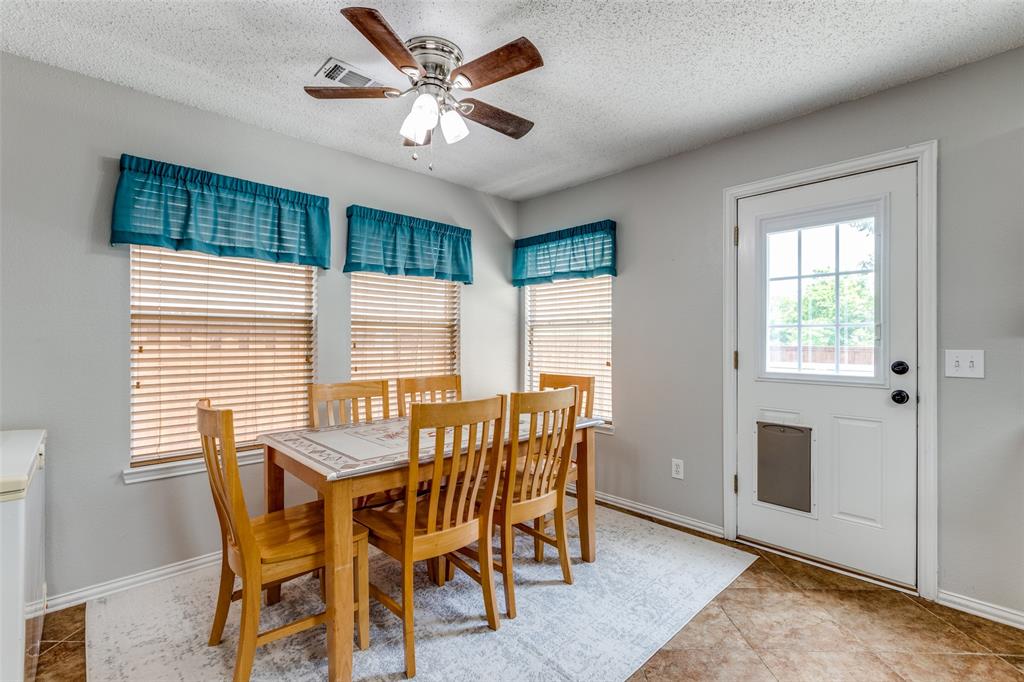 1017 Lake Trail Drive Little Elm, TX 75068 - Photo 20 of 35 a view of a dining room with furniture window and outside view
