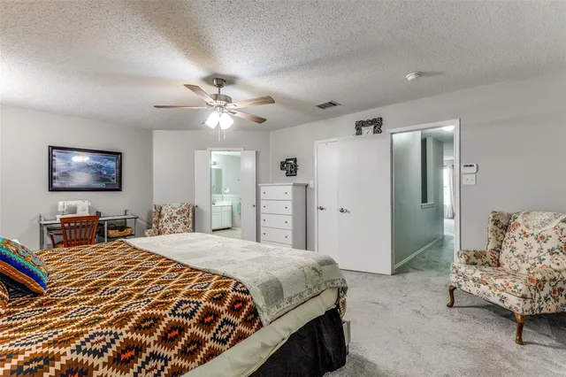 a spacious bathroom with a double vanity sink a mirror a vanity and a shower