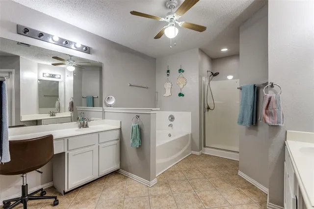 a bathroom with a double vanity sink a shower and a mirror