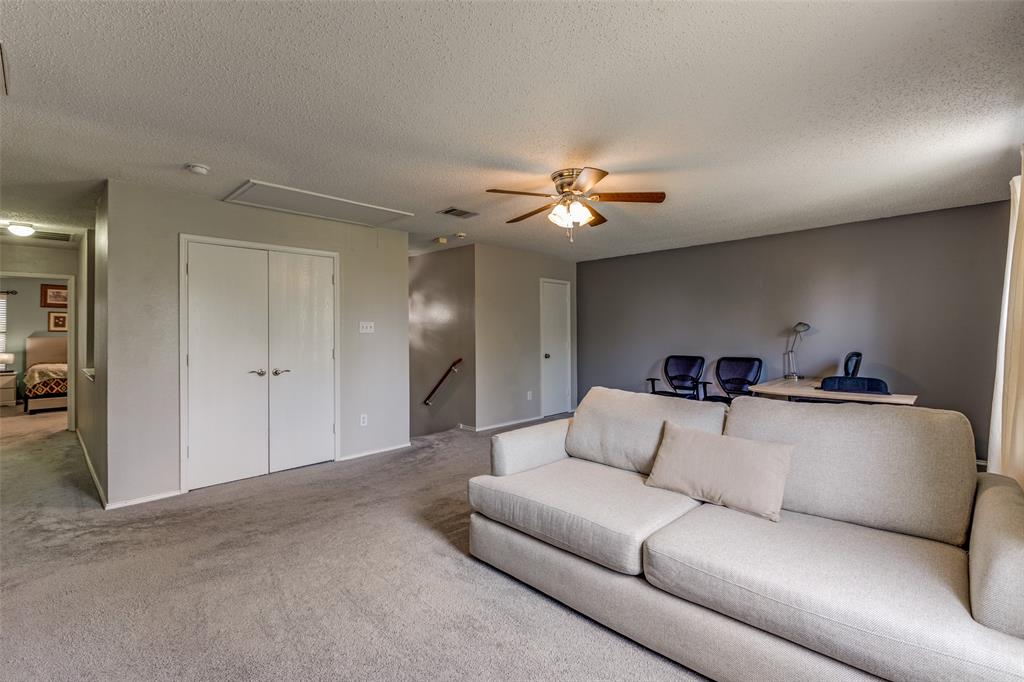 1017 Lake Trail Drive Little Elm, TX 75068 - Photo 27 of 35 a living room with furniture and a chandelier