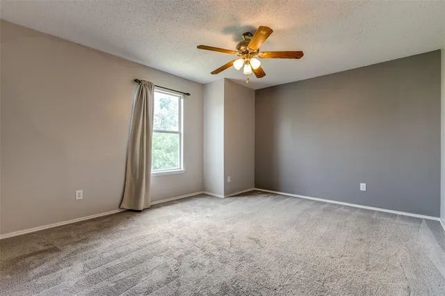 a bedroom with a bed and a desk