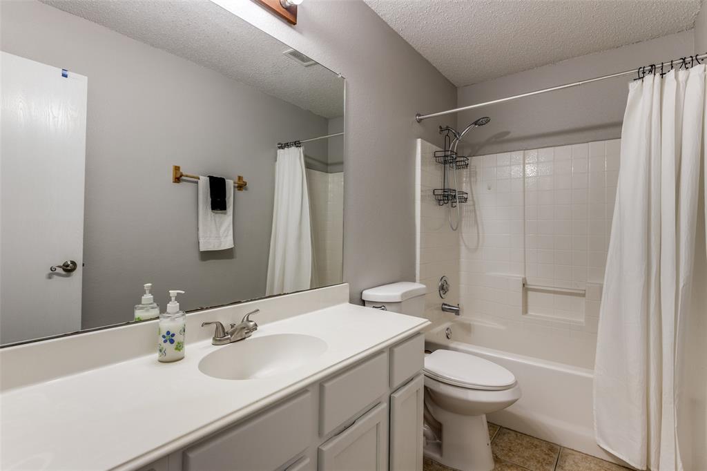 1017 Lake Trail Drive Little Elm, TX 75068 - Photo 31 of 35 a bathroom with a sink toilet and shower