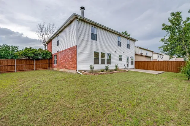 a view of yard with swimming pool and green space