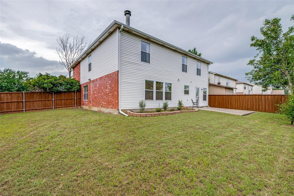 1017 Lake Trail Drive Little Elm, TX 75068 - Photo 34 of 35 a backyard of a house with lots of green space