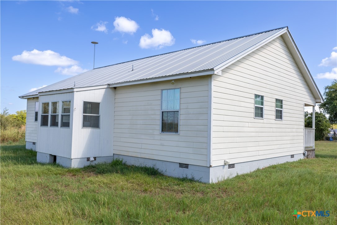 199 Sunset Trail Luling, TX 78648 - Photo 19 of 34 a view of a house with a yard
