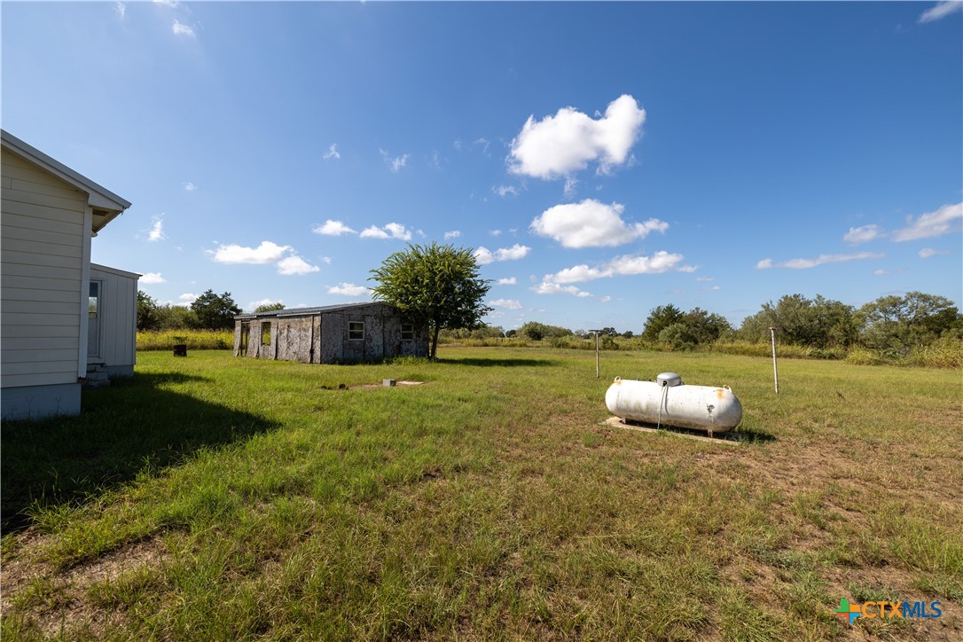 199 Sunset Trail Luling, TX 78648 - Photo 26 of 34 a view of a house with yard