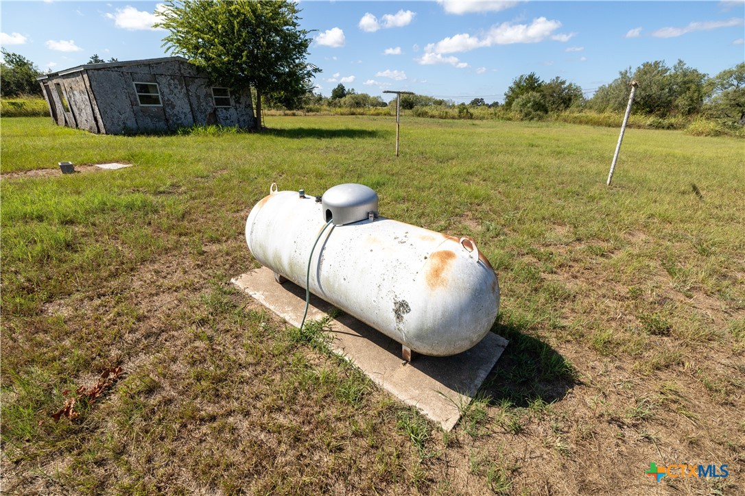 199 Sunset Trail Luling, TX 78648 - Photo 27 of 34 a view of a lake in front of house with outdoor seating
