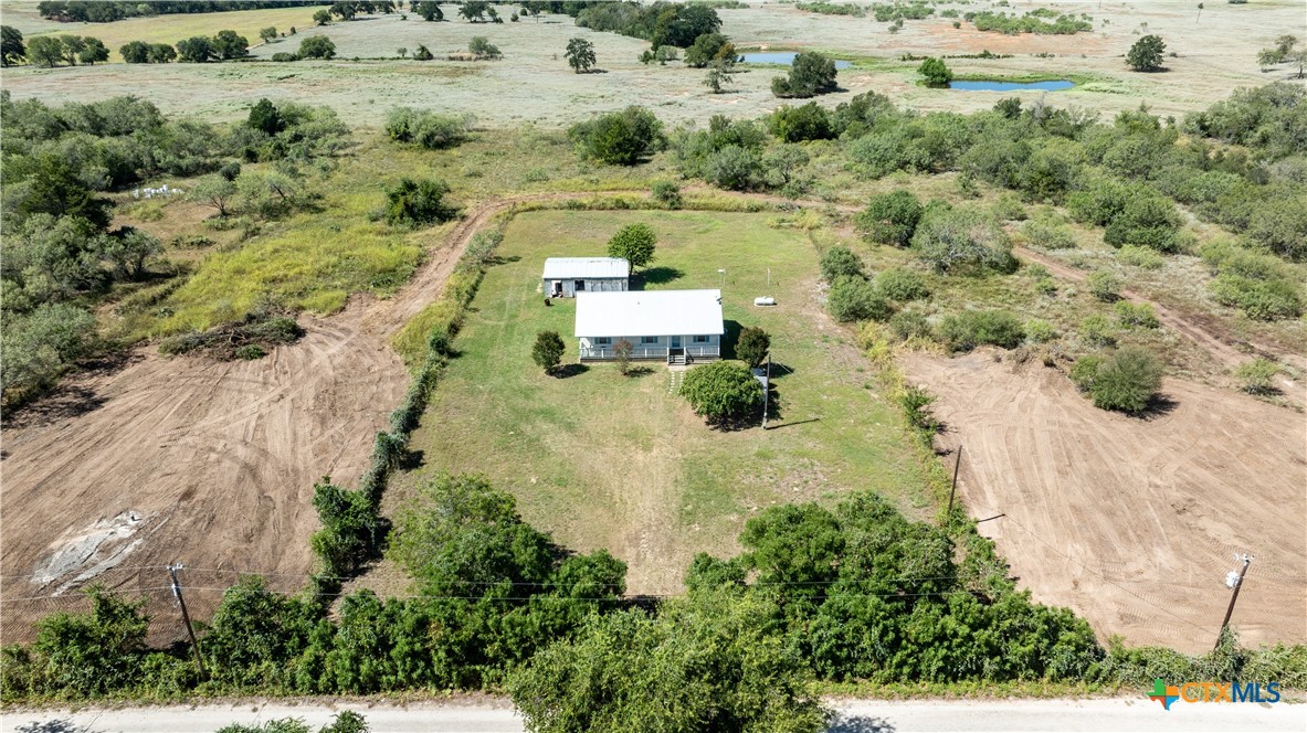 199 Sunset Trail Luling, TX 78648 - Photo 30 of 34 an aerial view of a house with a yard