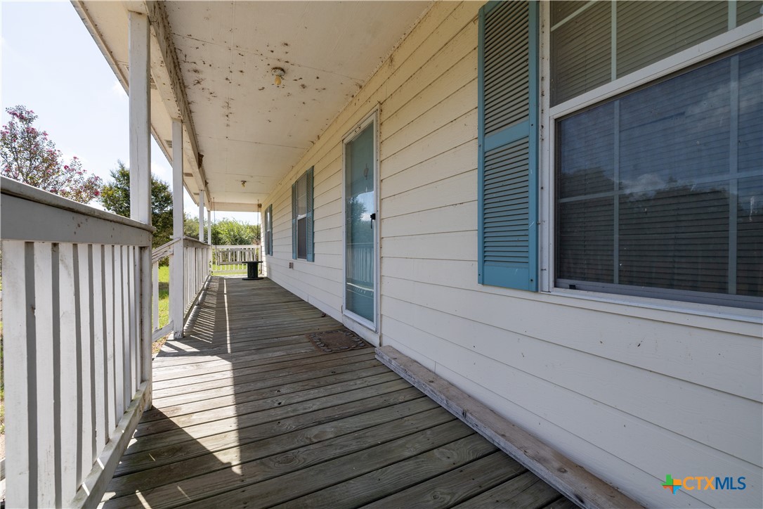 199 Sunset Trail Luling, TX 78648 - Photo 3 of 34 a view of a balcony with door