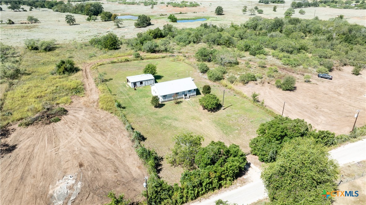 199 Sunset Trail Luling, TX 78648 - Photo 31 of 34 an aerial view of a houses with a yard